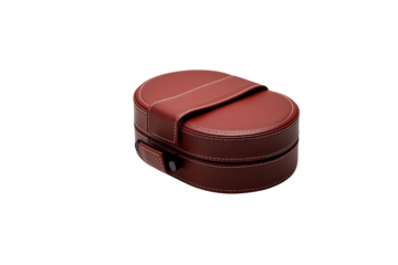 A red leatherette oval-shaped jewelry box with a hinged lid and clasp. background removed