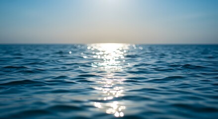Defocus blue sea with shimmering sunlight reflections