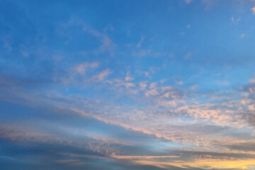 Nature sky background. Beautiful landscape with clouds and orange sun on sky. 