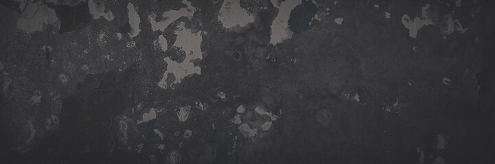 Dark wide panoramic background. Peeling paint on a concrete wall. Faded dark texture of old cracked...