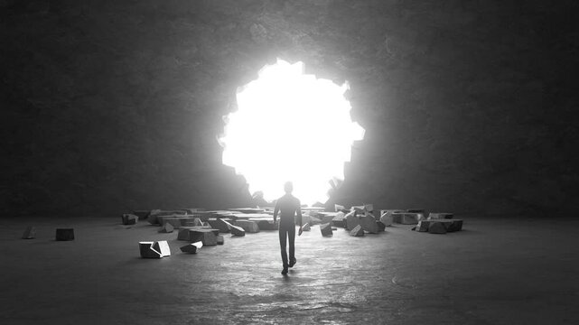 Businessman walks toward bright light through broken concrete wall in dark room, symbolizing hope, overcoming obstacles, and achieving success