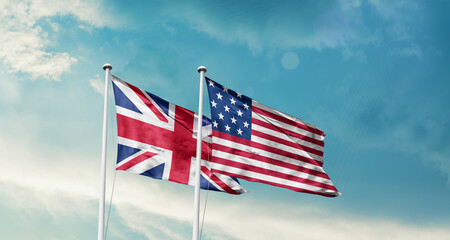 United Kingdom and America friendship flags are waving in the sky.Two country flag for agreement or deal. UK USA national flag for commitment. © Muhammad Arif
