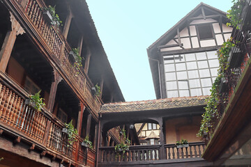 Wooden balcony on inner yard with traditional half-timbered house, Strasbourg, France