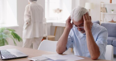 Serious frustrated senior man stress, problem, calculating payment online, watching laptop screen, feeling worry, old people elderly family home accounting, analyze bad financial account, poor budget - Powered by Adobe