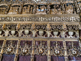 Gold gleeming Manueline choir stalls at Mosteiro de Santa Cruz monastery at Coimbra, Portugal