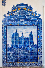 Historic building of old Aveiro Railway station ornamented with typical blue azulejos