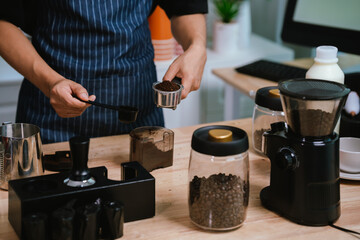 Barista pouring milk into cappuccino, creating latte art in cozy café setting, showcasing morning preparation, craftsmanship, and coffee culture indoors.