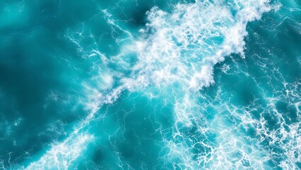 Fototapeta premium Aerial view of dynamic ocean water movement with foamy waves. Ideal for backgrounds, textures, or marine-themed designs in print and digital projects