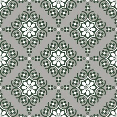 Indian ethnic tribal fabric pattern featuring floral designs in green and cream tones. Inspired by traditional Indian ethnic painting, this design embodies ethnic meticulous beauty and cultural elega