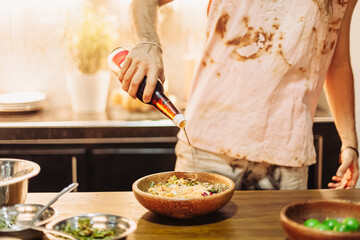Serving homemade vegan rice and curry dishes in a tropical kitchen. Colorful plates of plant-based food with various curry styles. Cozy, healthy, cruelty-free lifestyle