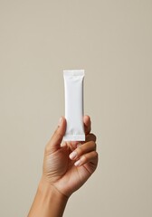 Close-Up of Woman's Hand Displaying Sachet Stick Mockup