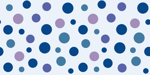 Pattern of various-sized blue and purple dots on a light background, creating a playful and modern design.