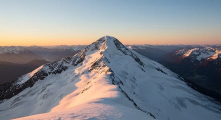 Naklejka premium Majestic Sunrise over Snow-Capped Mountain Peak