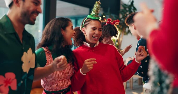 Dance, happy and friends at christmas party with music for fun, celebration or festive season. Laugh, event and group of people with xmas playlist for groove together with holiday song in home.