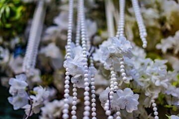 Elegant Floral Arrangement with Pearl Beads and White Flowers