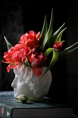 Flowers in the beautiful vase on the book