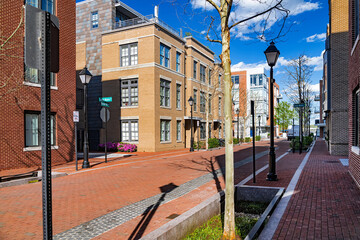 Beautiful brick street among modern brick residential houses.