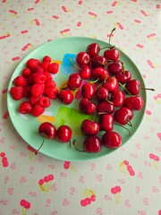 Healthy fruit plate with strawberries, cherry, melon  andraspberry . fruit salad