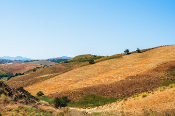 Obraz premium summer countryside landscape with the midday light inside Val D'Agri, Basilicata