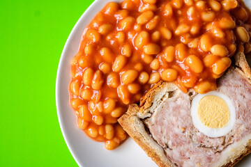 A Slice Of Pork And Egg Classic Gala Pie With Baked Beans