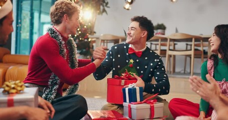 Christmas, friends and surprise with present on floor for secret santa, support or thank you. Social event, festive party and happy people with gratitude for gift giving and holiday tradition in home