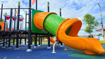 Asian child smiling playing on slider bar toy outdoor playground, exercise of motor development. Outdoors, development and portrait of kids for playing, freedom and summer adventure with smile.