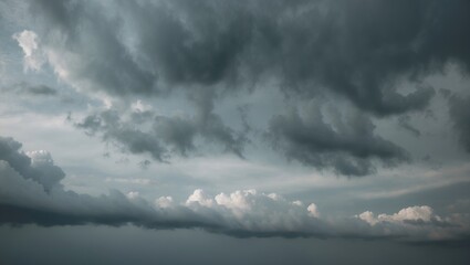 Obraz premium A Cloudy Sky With A Few Clouds In The Distance, The Sky Is Mostly Gray, With Scattered Clouds And Empty Space For Text.