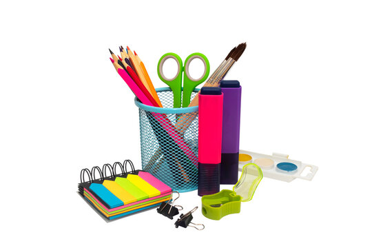 School and office supplies, pens, pencils, ruler, compass in a metal cup on a white background.