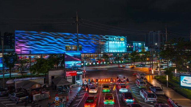 Traffic at intersection in bangkok night time