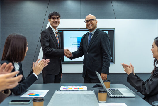 Happy diverse group Asian business team analyzing statistics financial. Group Team of business people meeting conference discussion various topic corporate concept in office.