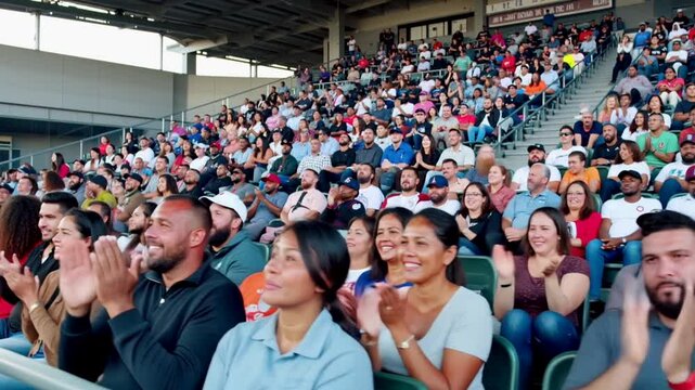 A crowd of people at a baseball game cheering