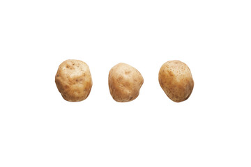 Fototapeta premium Three Potatoes: Three golden potato on a seamless surface, presenting versatility from farm to fork.