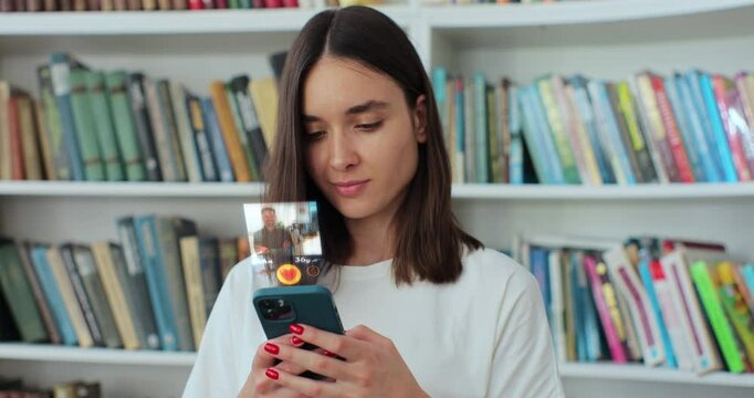 Beautiful woman using smartphone to browse social media dating app. Young woman uses dating app to text with people. Social media addiction and technology integration into everyday life.