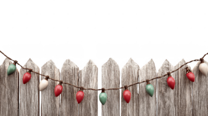 Red, green, and white christmas lights are hanging on a string across a rustic wooden fence, with a transparent background making it easy to add to any design