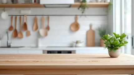 A wooden kitchen countertop with a polished finish placed in the foreground with a blurred view of a modern open concept kitchen in the background | empty for product display