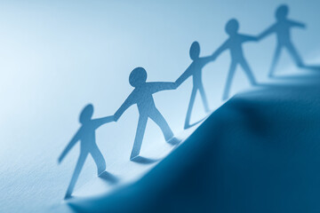 Paper chain people helping each other succeed