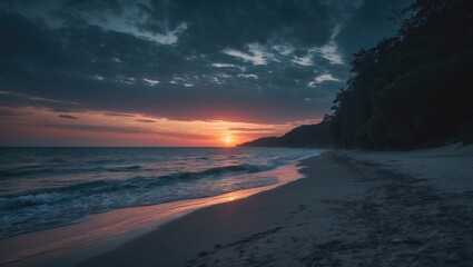 Obraz premium A View Of The Beach Sunset Landscape With The Sky Darkening In The Background