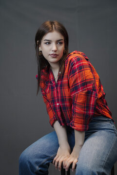 Fototapeta Stylish Woman in Casual Denim and Plaid Crop Top – Studio Fashion Portrait