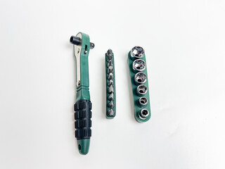 Preset torque wrench with cap head. Green and black coated handle. Working tool with reversible...