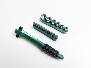 Preset torque wrench with cap head. Green and black coated handle. Working tool with reversible...