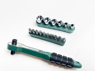 Preset torque wrench with cap head. Green and black coated handle. Working tool with reversible...