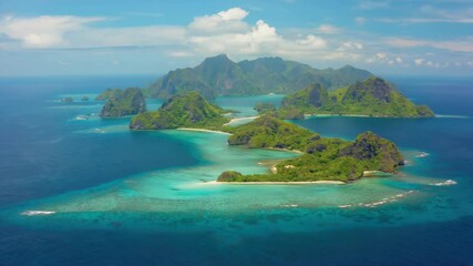 Breathtaking view of Fijian islands with lush vegetation, white sand beaches and crystal clear waters.
