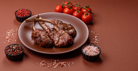 Juicy meat on the bone or rack of lamb. Grilled veal with salt, spices and herbs