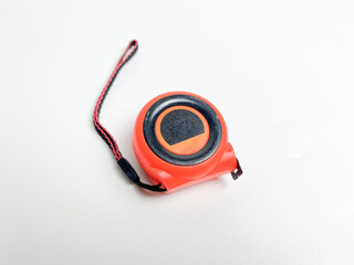 Black and orange measuring tape that can be stretched and held at a distance of 10 cm, measuring...