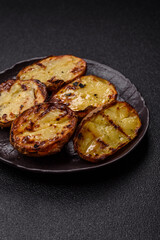 Food, potatoes cut in halves or slices grilled. Cooked baked potatoes