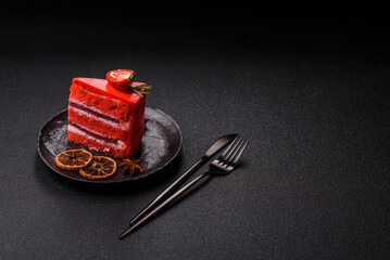 A piece of red velvet cake as a food background. Sweet pastries for celebration