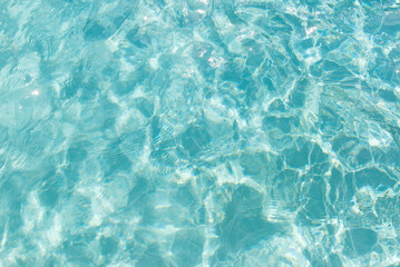 Sun-kissed water surface with abstract ripple texture
