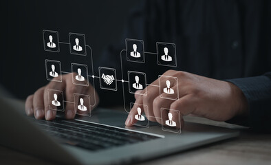 Business network interface showing connection of people and handshake icon on laptop screen. Perfect for teamwork structure, corporate communication, and digital partnership system.