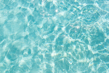 Soothing turquoise water with sunlight patterns