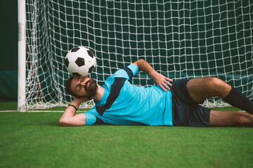 Naklejka premium Cinematic image of a soccer freestyle player making tricks with the ball.